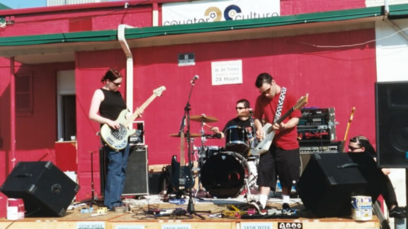 [Austin, TX] Again behind the Counter Culture clothing store, an "anti-SXSW" show during SXSW, it was so hot that Suzi evaporated into thin air.